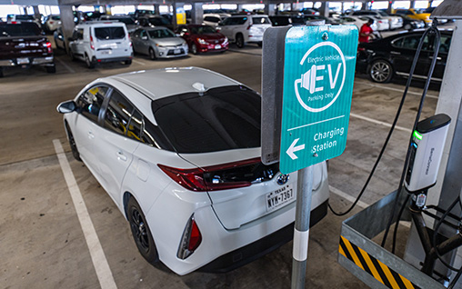 electric car charging at charging station